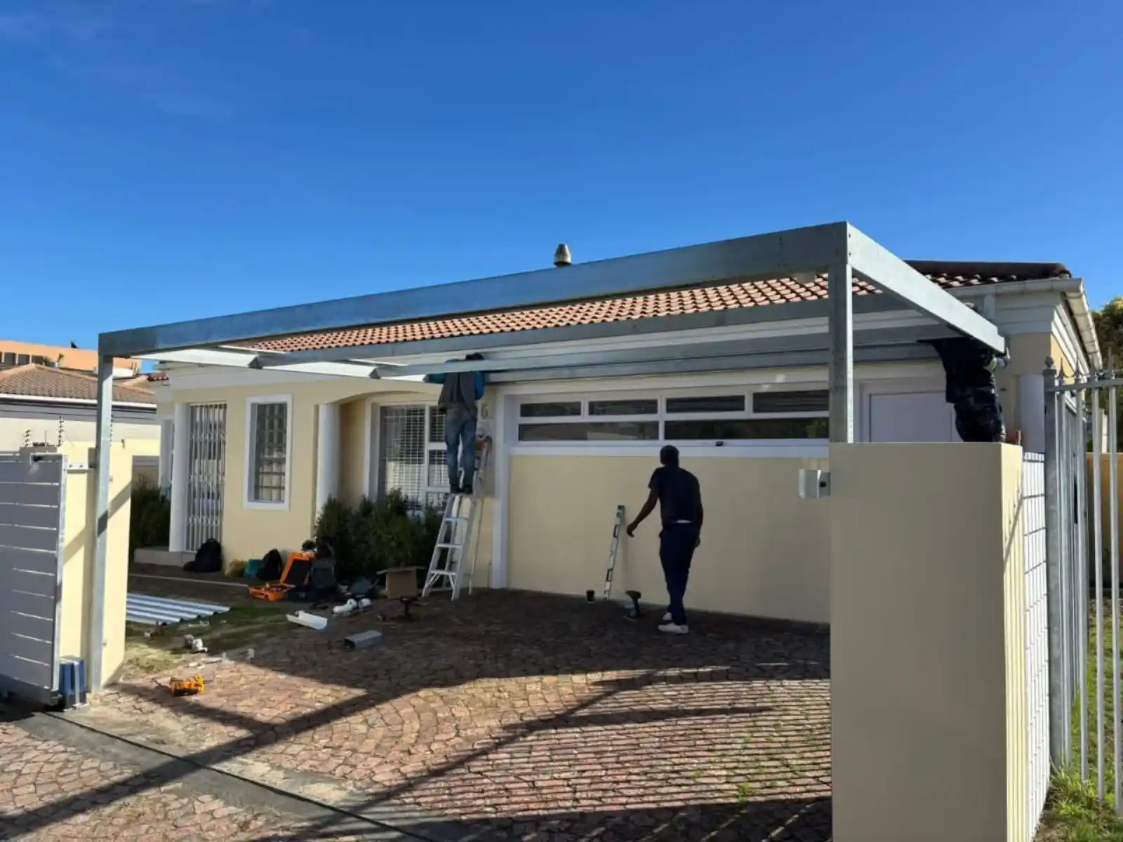 Cape Town Carports Team Installing a single steel carport