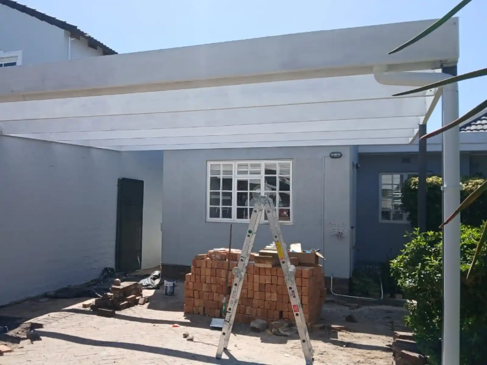 Painted wooden carport structure, Constantia