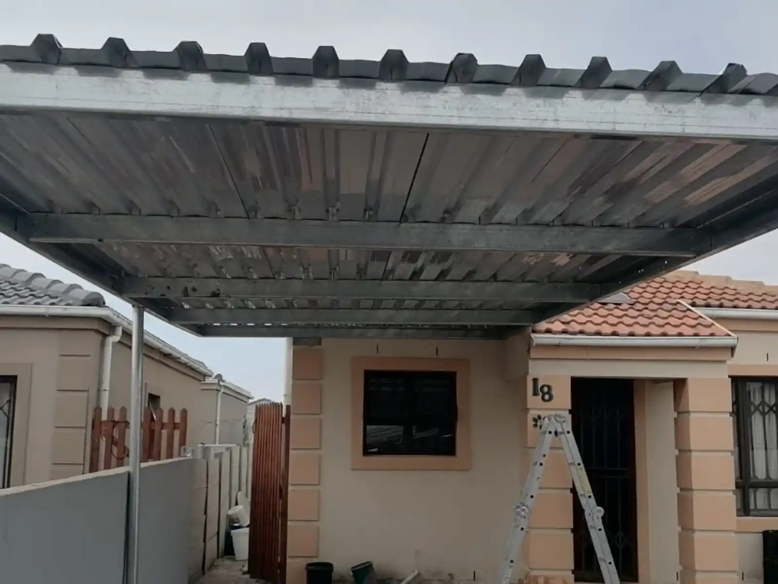 single steel carport just after completion